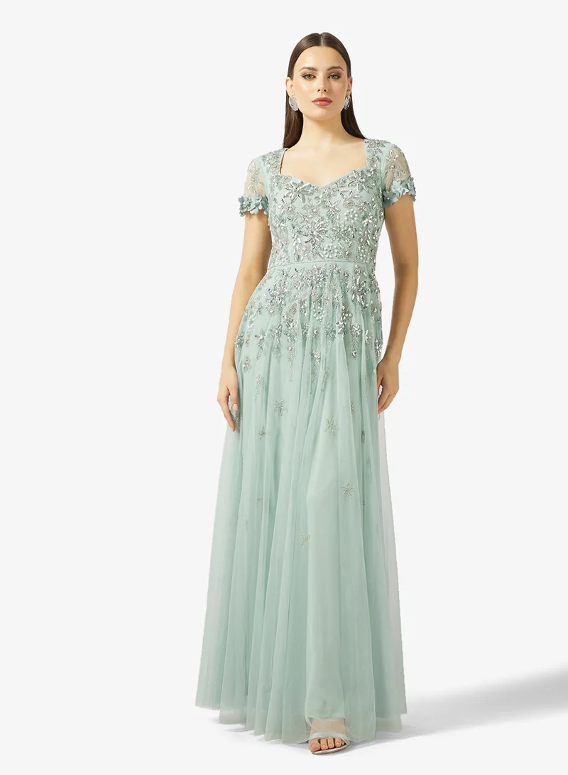 ادريانا بابيل فستان طويل شبكي بأكمام قصيرة